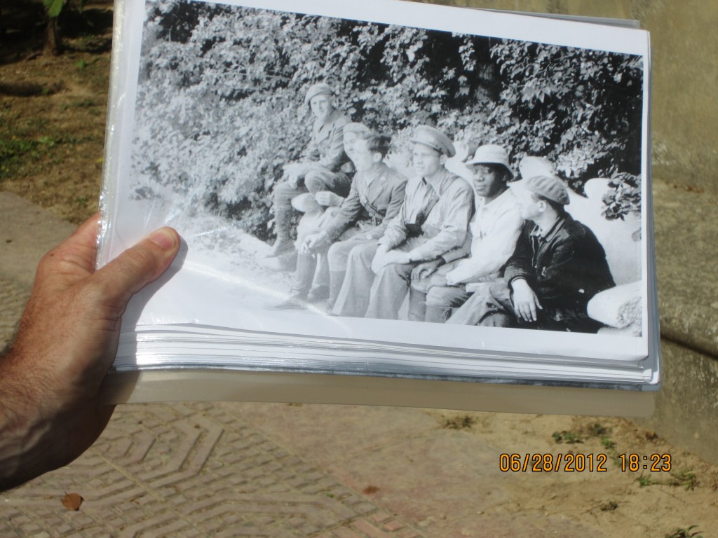 On the same grounds in the same time period, sitting on the concrete bench is the African American, Harry Haywood and Steve Nelson.