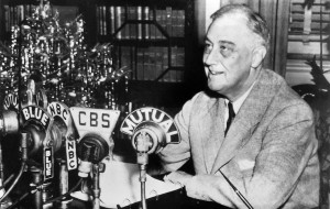 Franklin D. Roosevelt at his home in Hyde Park, New York, delivering a national radio address, 24 December, 1943. National Archives and Records Administration, Public Domain.