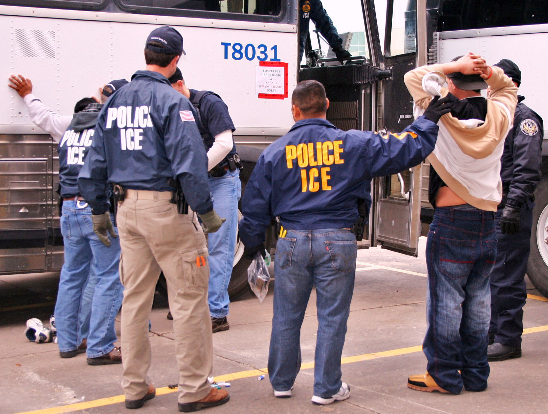 ICE Special Agents (U.S. Immigration and Customs Enforcement) arresting suspects during a raid. Houston, 2010. Photo Courtesy of ICE