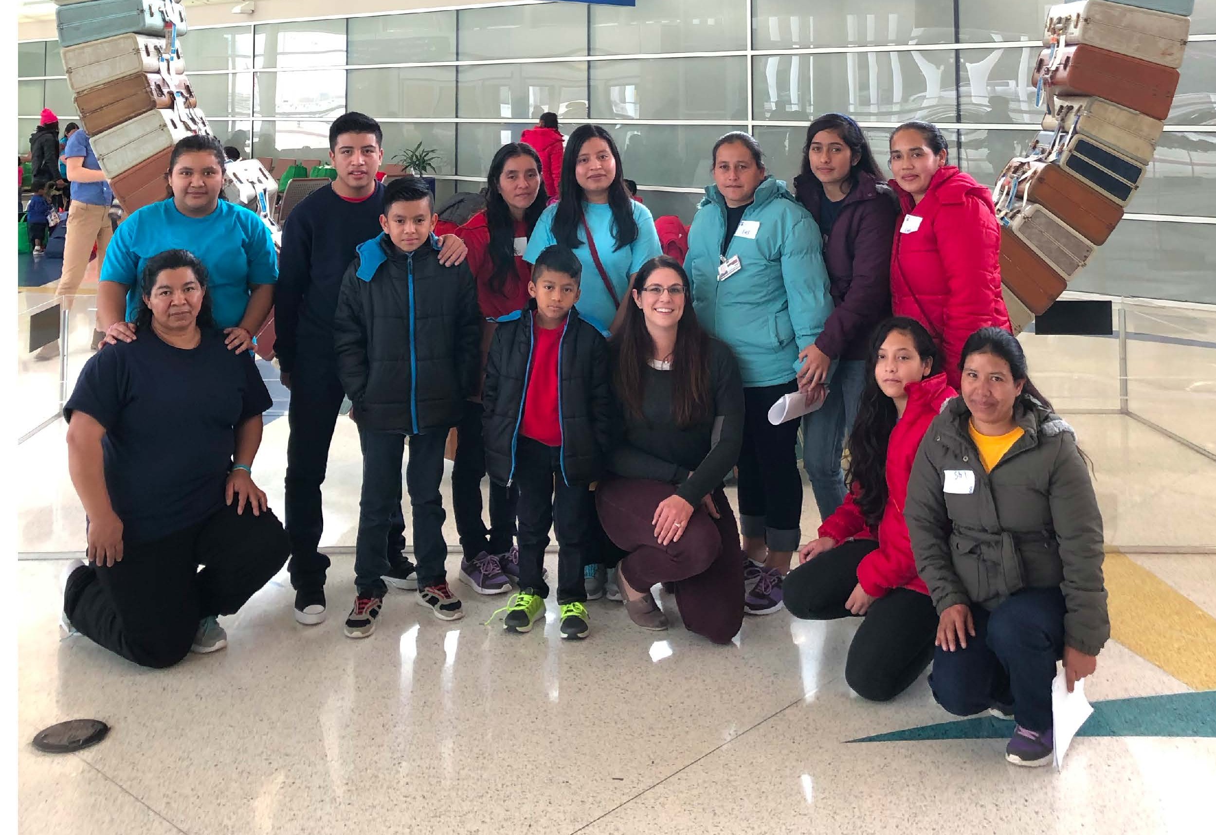 Mothers and children who were separated at the border and subsequently placed in family detention pose alongside the Managing Attorney at the Justice Campaign’s partner site, the Dilley Pro Bono Project, following their release from detention. Photo IJC.